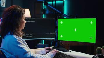 Cybersecurity expert uses green screen computer to look for security vulnerabilities and injected malware, close up. Admin installing fortified code on chroma key PC to prevent cyber attacks, camera B video