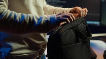 Computer scientist unpacking laptop bag, preparing to design and develop software applications. IT professional starting job shift, opening notebook to do coding, camera A video