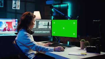 Woman using professional software on mockup PC to create visual effects for projects. Specialist using post production techniques to edit raw clips footage on green screen computer, camera B video