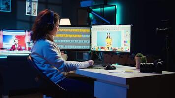 Photographer using editing software to edit photos and make adjustments while enjoying cup of coffee. Specialist color correcting pictures while listening music in headphones, camera B video
