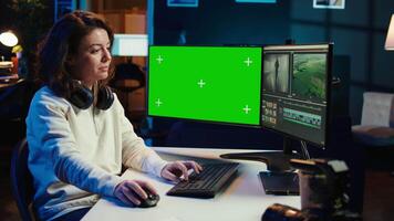 editor analyzing film montage on isolated screen display, editing color grading in office. Post production studio employee working with raw footage on chroma key PC, camera B video