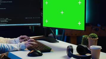 Cybersecurity expert uses green screen computer to look for security vulnerabilities and injected malware, close up. Admin installing fortified code on chroma key PC to prevent cyber attacks, camera A video