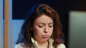 Upset teleworking engineer worried after failing to secure company servers from virus attacks, close up. Anxious woman stressed about being unable to build firewalls protecting data, camera A video