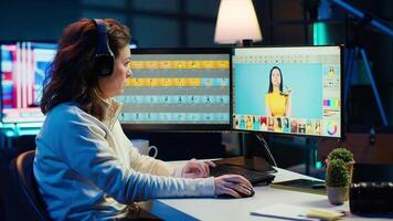 Freelancer editing professional photographs, working in home studio while enjoying music. Photo editor using headphones to listen favorite songs while using editing software, camera A video