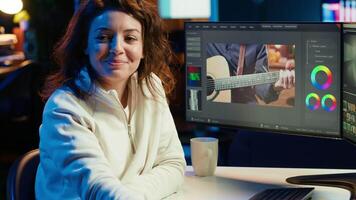 editor selecting key frames to use while doing montage, working from home on computer. Cheerful woman using mouse to edit movie project footage in office, camera A video