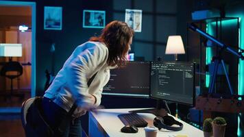 Computer scientist arriving in home office, ready to design and develop software applications. IT expert starting job shift, implementing and maintaining company systems, camera B video