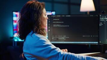 Freelancing programmer listening music while designing and developing software applications. IT specialist wearing headphones, implementing and maintaining company systems, camera A video