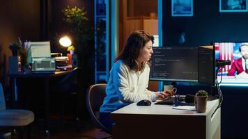 Programmer stretches body limbs after securing company servers from virus attacks all day. Fatigued IT remote employee relaxing tense muscles at desk after building firewalls protecting data, camera A video