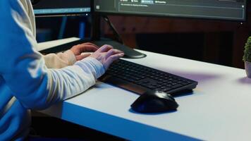 Teleworking computer technician typing on keyboard, implementing security measures to protect company systems and data, close up. Remote IT employee at home debugging code for software, camera A video