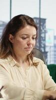 Vertical Ambitious businesswoman demonstrating her leadership skills, focusing on company growth, productivity and innovation. Leader setting a powerful example in the corporate environment. Camera B. video