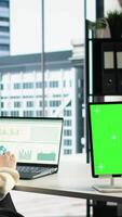 Vertical General director using chroma key template on modern gadget, developing her business within the industry. Female entrepreneur with ambition in her high end corporate office. Camera A. video