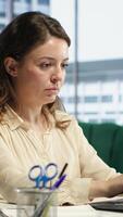 Vertical Powerful female entrepreneur focuses on strategic planning, setting a clear vision and goals for the corporation and aligning resources to achieve growth. Ambition and determination. Camera A. video