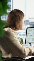 Vertical Woman in executive role oversees budget analysis and investment strategy, showcasing her commitment to financial success and sustainable growth in the corporate sector. Work ethic. Camera B. video