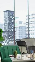 Vertical Empty modern corporate high end office space designed for a CEO or person with authority, running analytics and reports on screen. Urban global enterprise workspace, empowerment. video