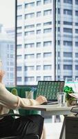 Vertical General director searching for an investment solution and the right offer, avoiding trading risks using funds to increase company profit. Entrepreneur planning finances in high end office. Camera B. video