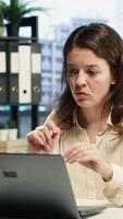 Vertical Woman entrepreneur uses her leadership skills to navigate challenges in the corporate world, emphasizing innovation, multitasking and strategic planning to achieve business success. Camera A. video
