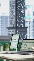 Vertical Empty luxurious corporate high end office designed for a CEO or leader, running analytics and data driven insights on screen. Urban global enterprise, business empowerment. Camera B. video