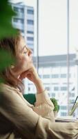 Vertical Young entrepreneur with leadership skills creates a financial report, demonstrating her expertise in analysis, forecasting and ensuring the company stability. Strategic thinking in office. Camera B. video