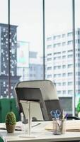 Vertical Modern work environment in a urban corporation downtown building, high end workspace with business analytics trends running on screen. Career development, office life concept. video