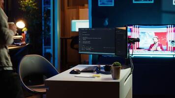 Developer holding disposable cup of coffee entering office to implement security measures, protecting company systems and data. IT worker starting job shift, testing and debugging code, camera A video