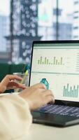 Vertical Powerful female leader evaluates a strategic review of the company activity, analyzing market trends and setting new priorities. Ensuring the enterprise objectives achievements. Camera A. video