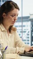 Vertical Portrait of powerful woman CEO working in a modern corporate office, managing daily business operations, optimizing workflow and ensuring the company meets its performance targets. Camera A. video