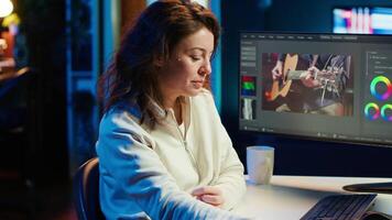Portrait of professional editor editing color grading and lighting in creative office, analyzing film montage, close up shot. Post production videographer manipulates raw footage, camera A video