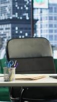 Vertical Empty modern corporate high end office space designed for a CEO or person with authority, running analytics and reports on screen. Urban global enterprise workspace, empowerment. video
