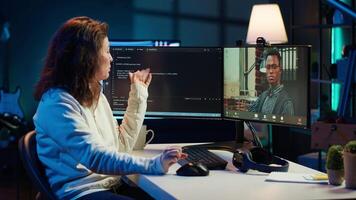 Software engineer teacher doing online tutoring, talking with student in online videocall about ways to do debugging. IT master teaching apprentice in webinar how to write code, camera A video
