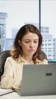 Vertical Empowered ambitious female CEO working on career development strategy, multitasking to increase enterprise profit. Decision making leadership skills for productivity and work ethic. Camera B. video