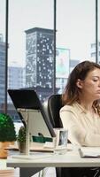 Vertical Determined businesswoman coming up with ways to increase company profit, thinking of improving the sales and services to ensure enterprise success and growth. Global management. Camera B. video