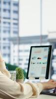 Vertical Ambitious female leader developing a new business plan, showcasing her expertise in target analysis, strategic thinking and commitment to achieving company objectives. Decision making. Camera B. video