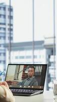 Vertical Female director discusses corporate social responsibility on videocall, emphasizing the importance of ethical practices and sustainability for business success. Advisory board meeting. Camera B. video