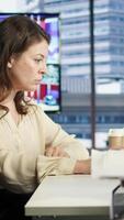 Vertical Woman in a powerful executive role oversees budget analysis for investment strategy, showcasing commitment to financial success and sustainable growth in the corporate sector. Camera A. video