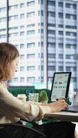 Vertical Empowered female CEO working in her high end corporate office, focusing on career development and maintaining a productive goal oriented work environment. Strategic thinking for growth. Camera B. video