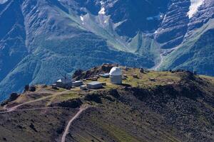 astronomical observatory in high mountainous terrain photo