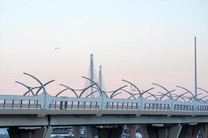 urban background with a fragment of a high-speed automobile overpass on the background of a bridge photo
