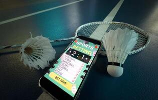 a badminton racket and a smartphone with sports bets photo