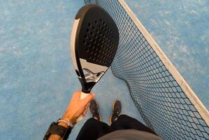 paddle tennis player, hands and racket ready for serve photo