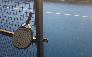 paddle rackets on the playing court photo