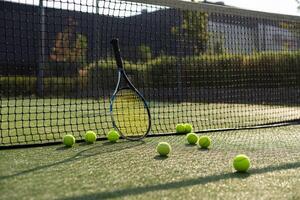Leeds UK May 24 2016 Tennis ball and racket on a hard court with coloured filter applied during processing-illustrative editorial photo