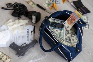 Handcuffs on many stacks of dollar bills. Metal suitcase with money, concept of arrest, investigation and fraud. photo