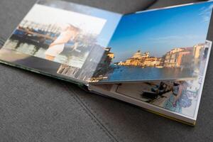 a Photobook of family at home on a background. Photobook is gift. professional photographer and designer. printing of photos and journals in photo laboratory
