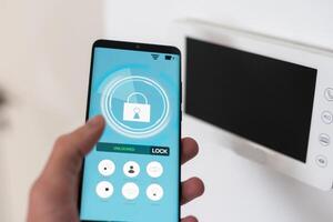 Close up focus on cellphone with smart home software application on screen, wireless light music temperature regulation with digital gadget, air conditioner climate control, iot, virtual assistant photo