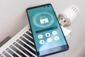 Smart Home. Man Controlling Heating Using App photo