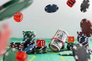 A very close up shot of 2 dice rolling on a green felt table top in very crisp focus, showing 4, 5 and 6 on the faces. photo