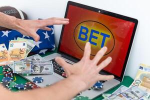 a mobile phone shows a betting application with live results and updates with white background. Online betting concept. photo