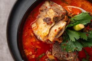 Soto Tangkar is Betawi food. The name Tangkar itself is a term for beef ribs in Betawi language. Soto Tangkar cooked in thin coconut milk soup spiced with red curry. photo