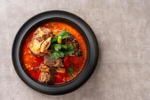 Soto Tangkar is Betawi food. The name Tangkar itself is a term for beef ribs in Betawi language. Soto Tangkar cooked in thin coconut milk soup spiced with red curry. photo
