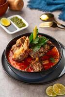 Soto Tangkar is Betawi food. The name Tangkar itself is a term for beef ribs in Betawi language. Soto Tangkar cooked in thin coconut milk soup spiced with red curry. photo
